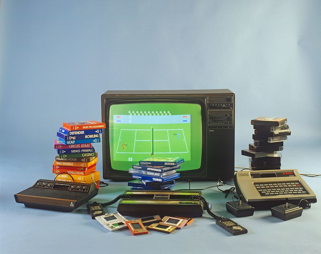 Home video games in the 1980s. A selection of the most popular game entertainment products in front of a television set. Atari, Intellivison, Philips Videopac G7000 and handheld consoles Game & Watch from Nintendo. 1980s. ref BV97-2 (Photo by SjÃ¶berg BildbyrÃ¥/ullstein bild via Getty Images)