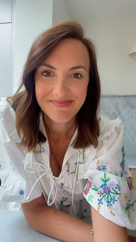 selfie of a brunette woman smiling 