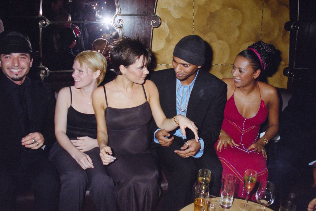 Jimmy can be seen sitting next to Victoria Beckham