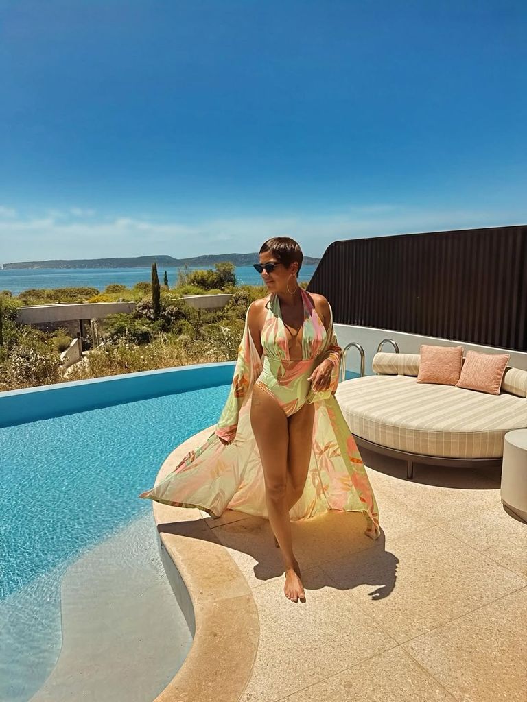 tamron hall in a swimsuit by the pool 