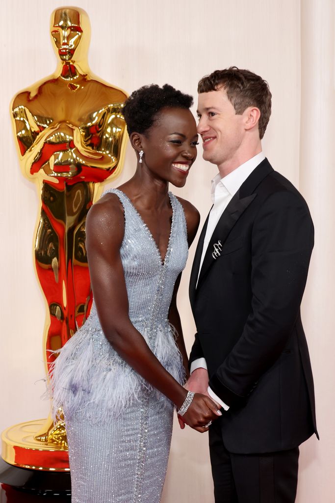 Lupita Nyong'o and Joseph Quinn attend the 96th Annual Academy Awards on March 10, 2024 in Hollywood, California. (Photo by Mike Coppola/Getty Images)