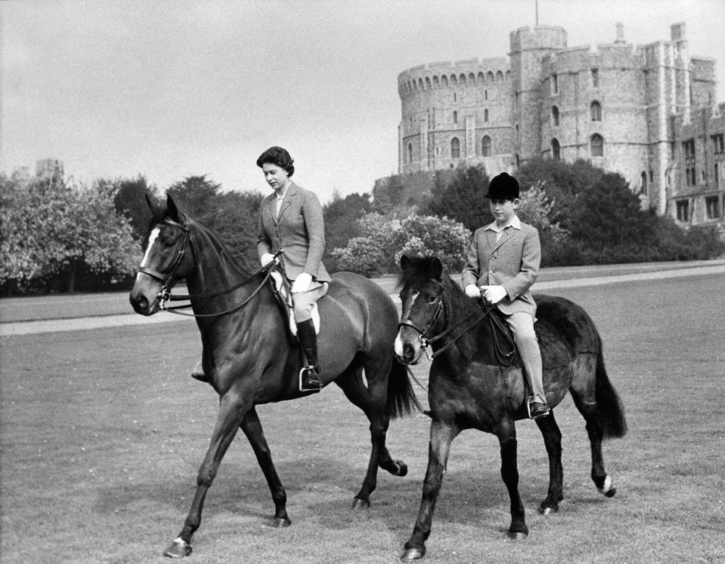 Queen Elizabeth II of England and Prince Charles sweetly rode in the park of Windsor Castle together