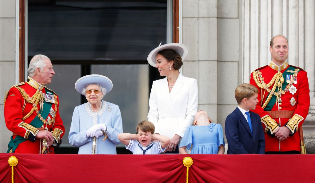 Prince Charles, Prince of Wales, Queen Elizabeth II, Prince Louis of Cambridge, Catherine, Duchess of Cambridge, Princess Charlotte of Cambridge, Prince George of Cambridge and Prince William, Duke of Cambridge watch a flypast from the balcony of Buckingham Palace 