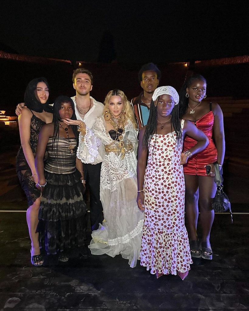 Madonna surrounded by her six children