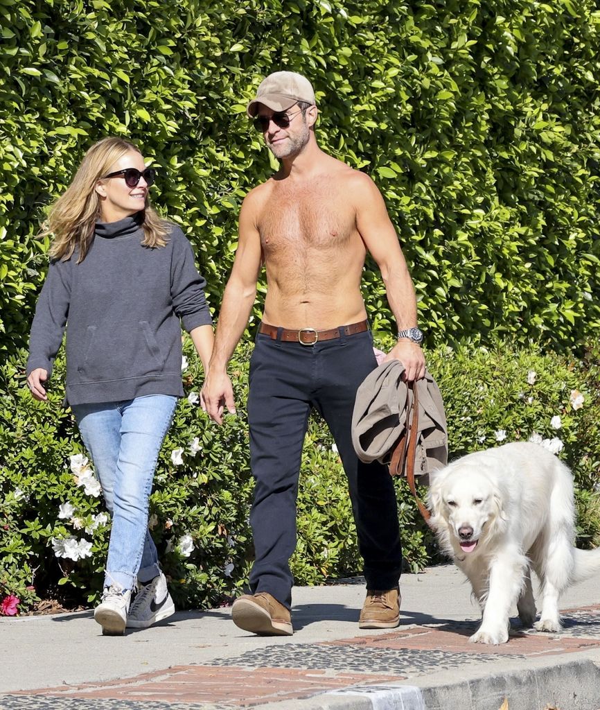 Becki newton with her husband Chris Diamantopoulos who went shirtless for their walk