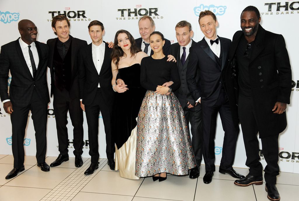 LONDON, ENGLAND - OCTOBER 22:  (EMBARGOED FOR PUBLICATION IN UK TABLOID NEWSPAPERS UNTIL 48 HOURS AFTER CREATE DATE AND TIME. MANDATORY CREDIT PHOTO BY DAVE M. BENETT/WIREIMAGE REQUIRED)  (L to R) Adewale Akinnuoye-Agbaje, Chris Hemsworth, Jonathan Howard, Kat Dennings, Stellan Skarsgard, Natalie Portman, Christopher Eccleston, Tom Hiddleston and Idris Elba attend the World Premiere of "Thor: The Dark World" at Odeon Leicester Square on October 22, 2013 in London, England.  (Photo by Dave M. Benett/WireImage)