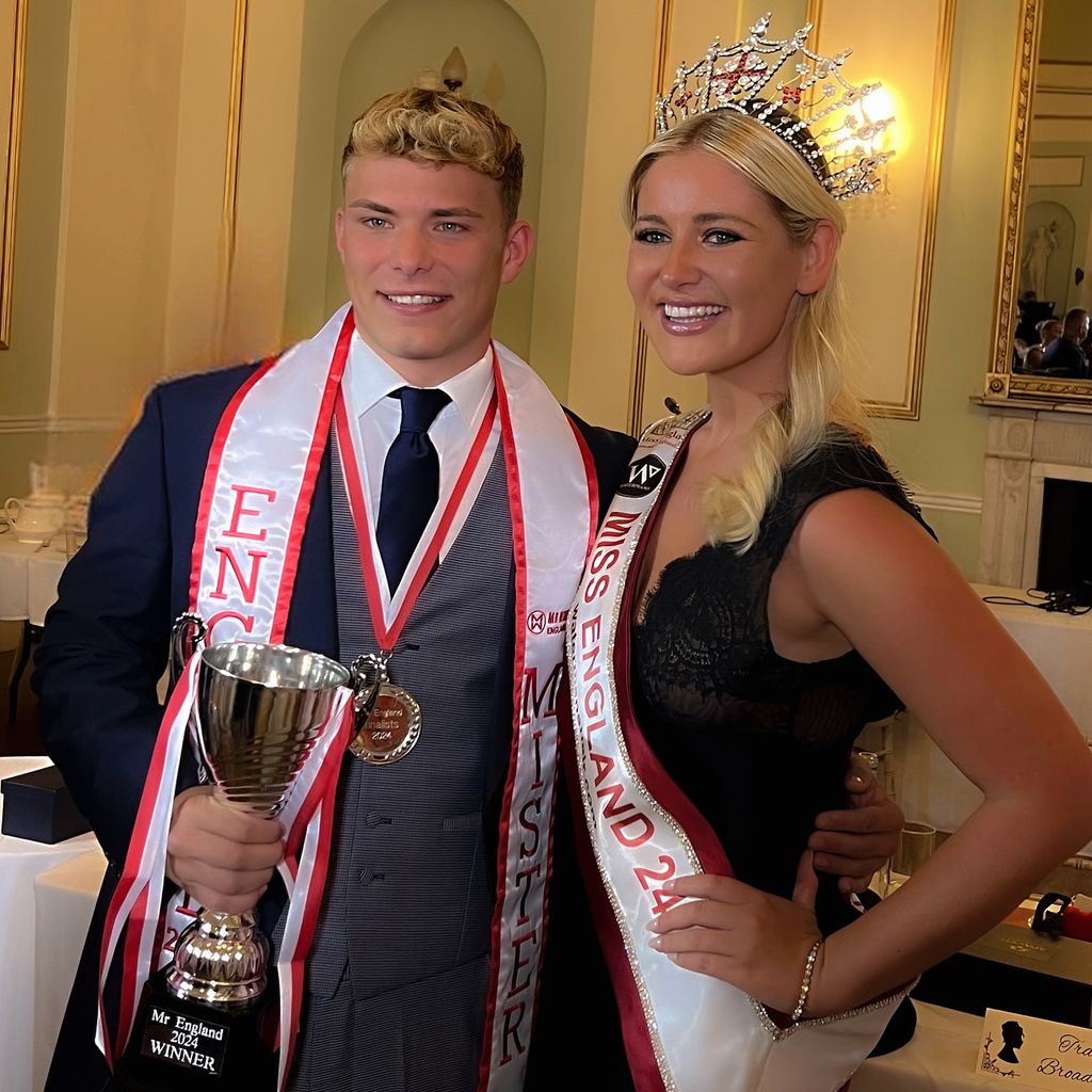 Manuel holding his trophy alongside Miss England, Mila Magee