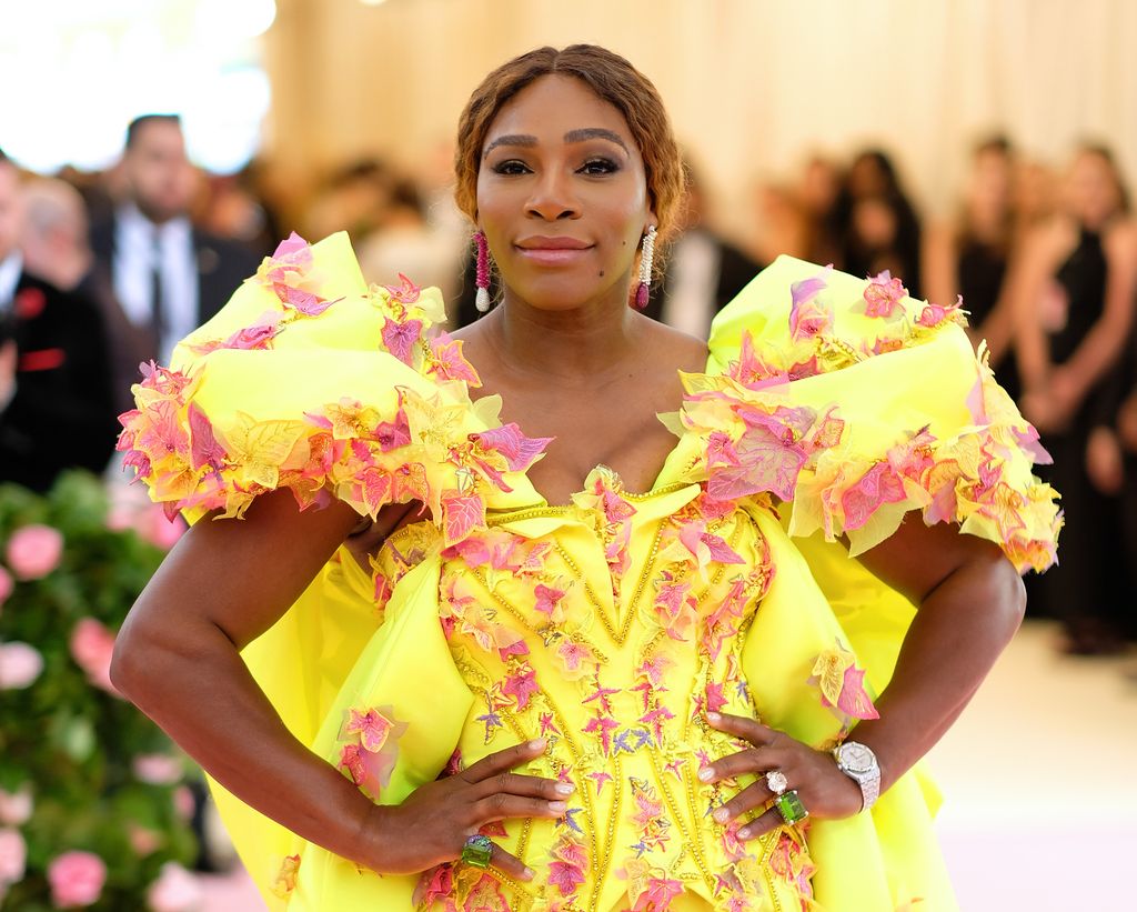 Serena Williams in yellow and pink dress