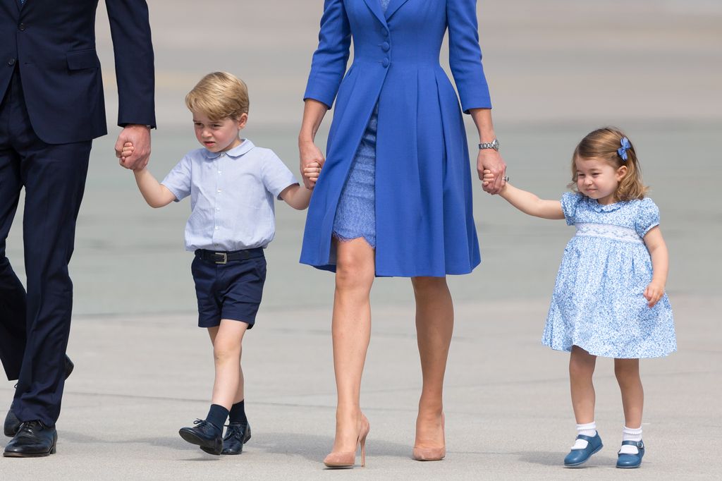 prince george and princess charlotte holding hands with parents