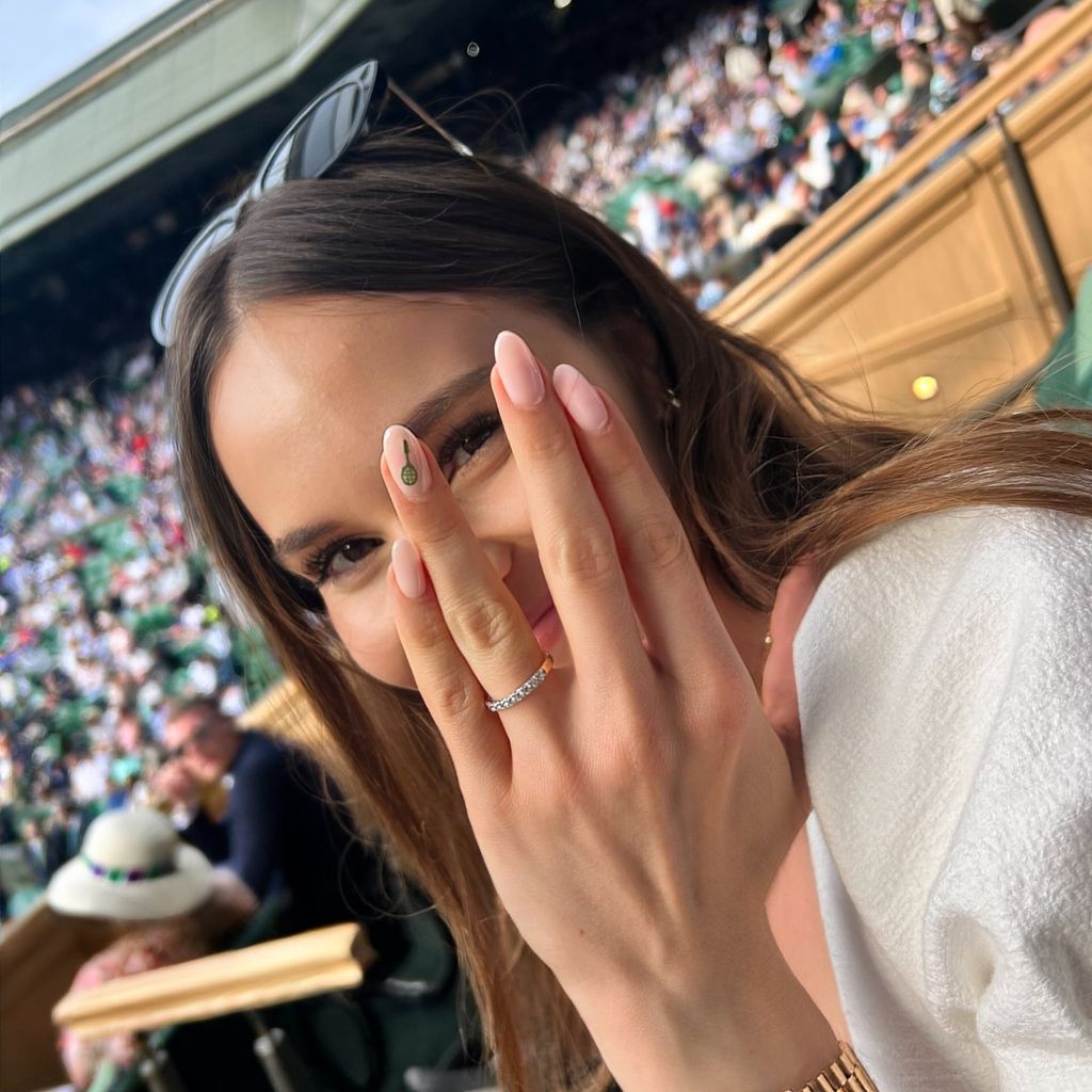 A photo of Holly Ramsay showing her hand to the camera