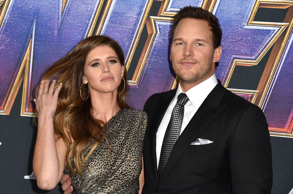 Katherine Schwarzenegger flipping her hair back next to Chris Pratt