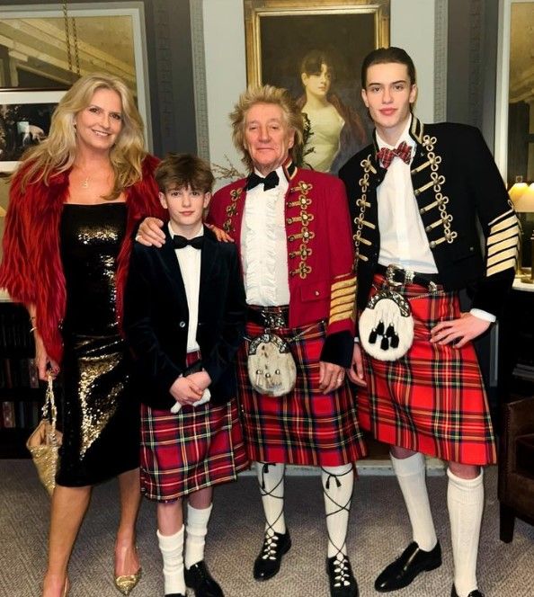 Penny with Aiden, Rod and Alastair in kilts