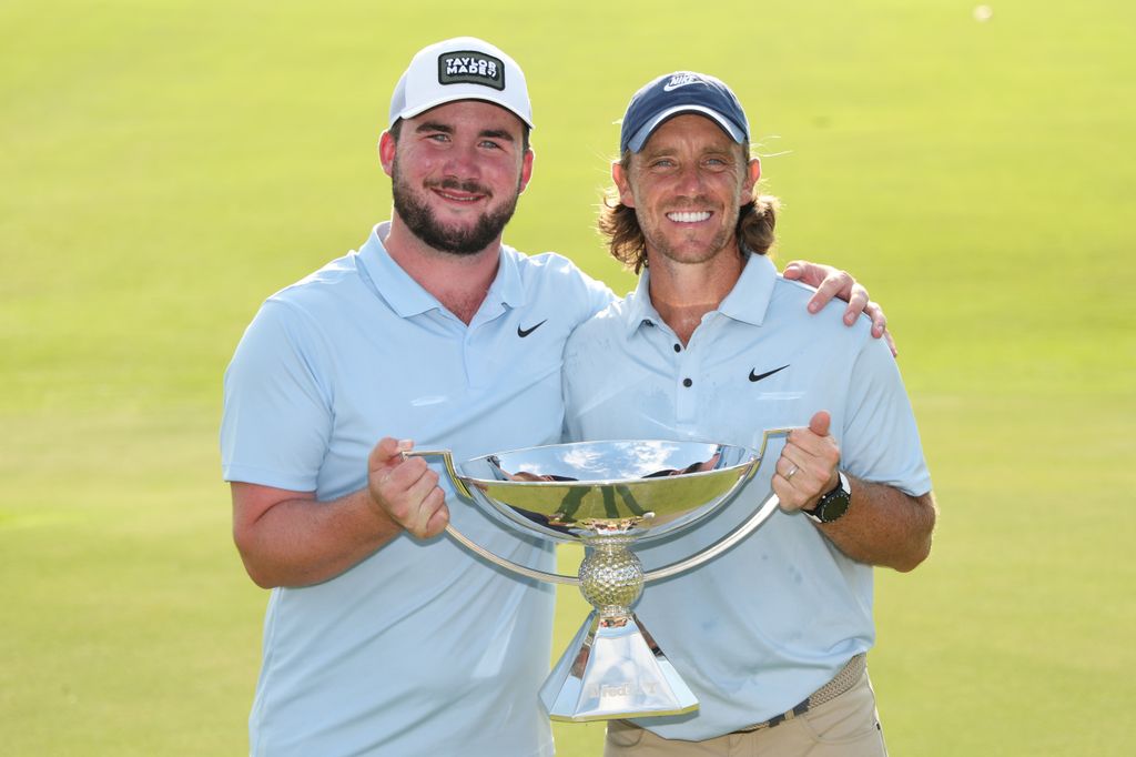 Tommy Fleetwood of England poses with the Fedex Cup trophy and his stepson, Oscar Craig, after winning the final round of the TOUR Championship 2025 at East Lake Golf Club on August 24, 2025 in Atlanta, Georgia