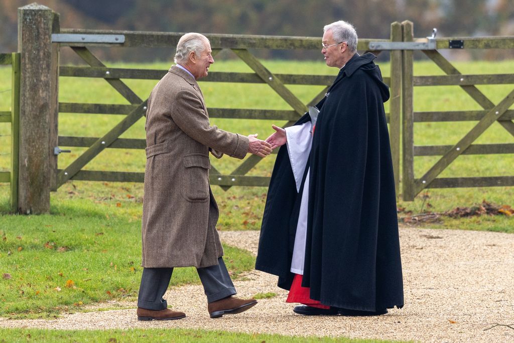 king shaking hands with reverend 
