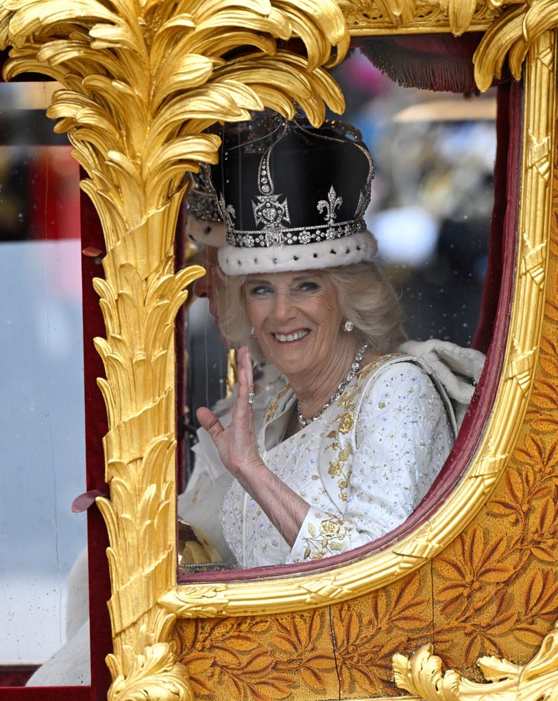 Queen Camilla waving to crowds