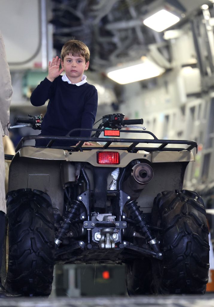 Prince Louis sits in a vehicle at air show