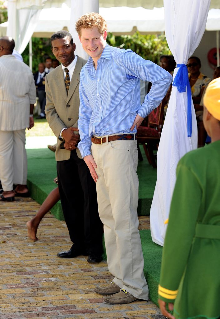 Prince Harry attends a Garden Party for Barbados' orphaned and vulnerable children at the Garrison Museum on January 30, 2010 in Bridgetown, Barbados. The Prince toured the museum's Africa Gallery, watched cultural performances by local Barbados performers and met some of the young children attending the event. Prince Harry is visiting the island with Prince Seeiso of Lesotho where they will launch and compete in the Sentebale Polo Cup at the Apes Hill Polo Club in Barbados on Sunday 31st of January. The Sentebale Polo Cup will help raise funds to support Lesotho's vulnerable children.  (Photo by Gareth Cattermole/Getty Images)