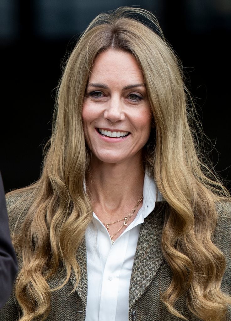 Kate Middleton smiling with bouncy blonde hair