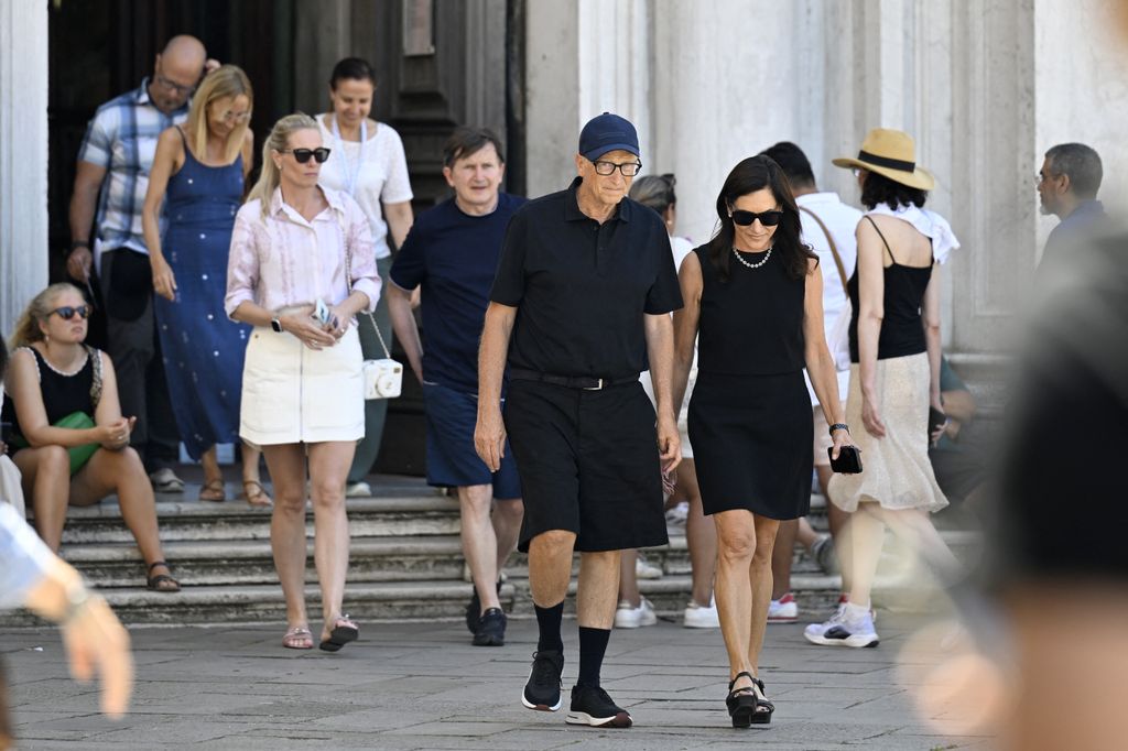 US tech entrepreneur Bill Gates and partner Paula Hurd leave after a visit at the Gallerie dell'Accademia di Venezia, ahead of US Amazon founder Jeff Bezos' wedding with Lauren Sanchez