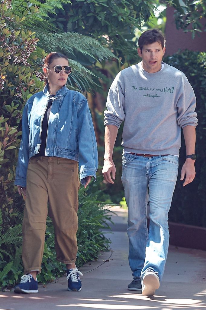Ashton and Mila photographed on romantic stroll