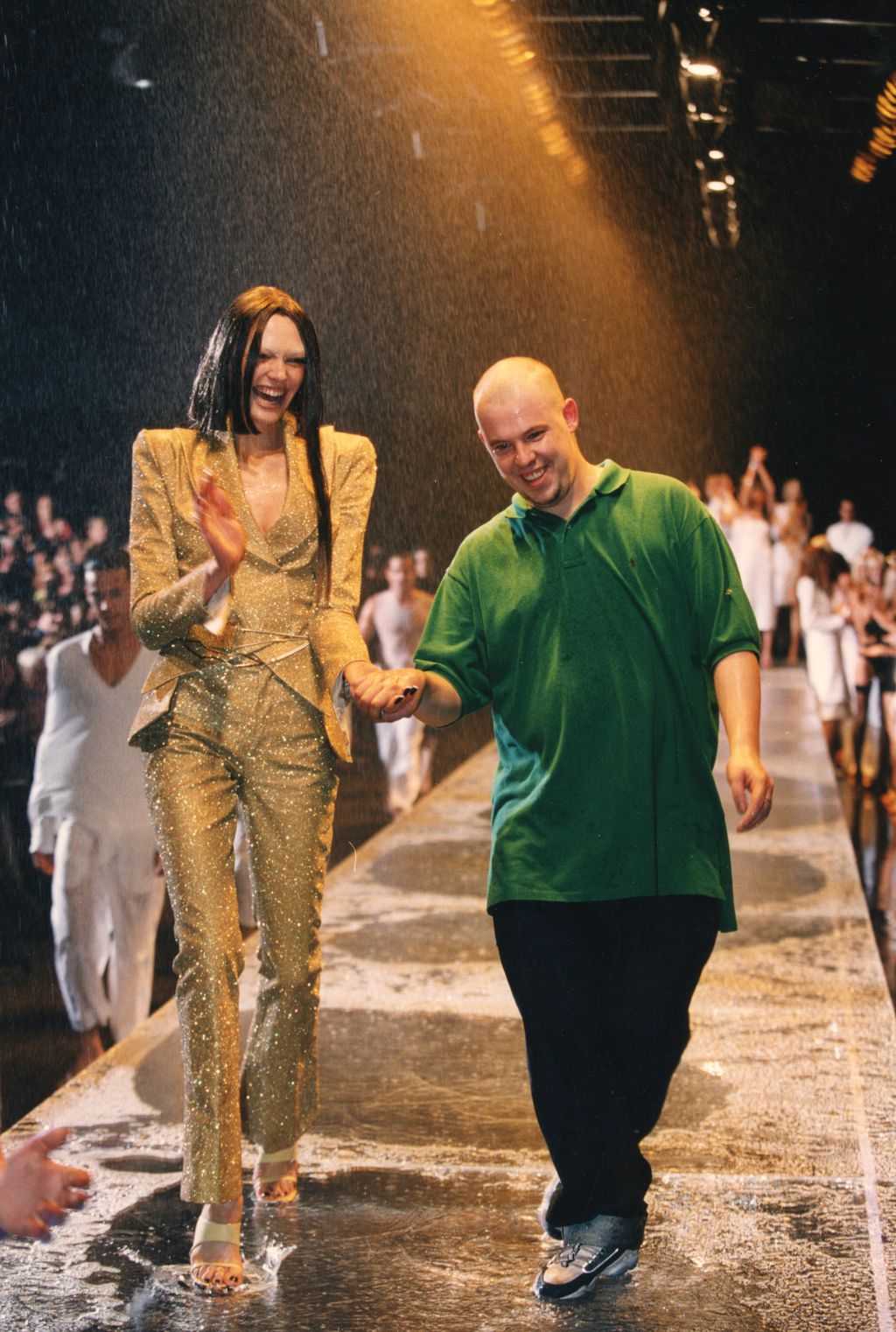 Alexander McQueen with a model at his London Spring/Summer Collection  fashion show on September 28, 1997