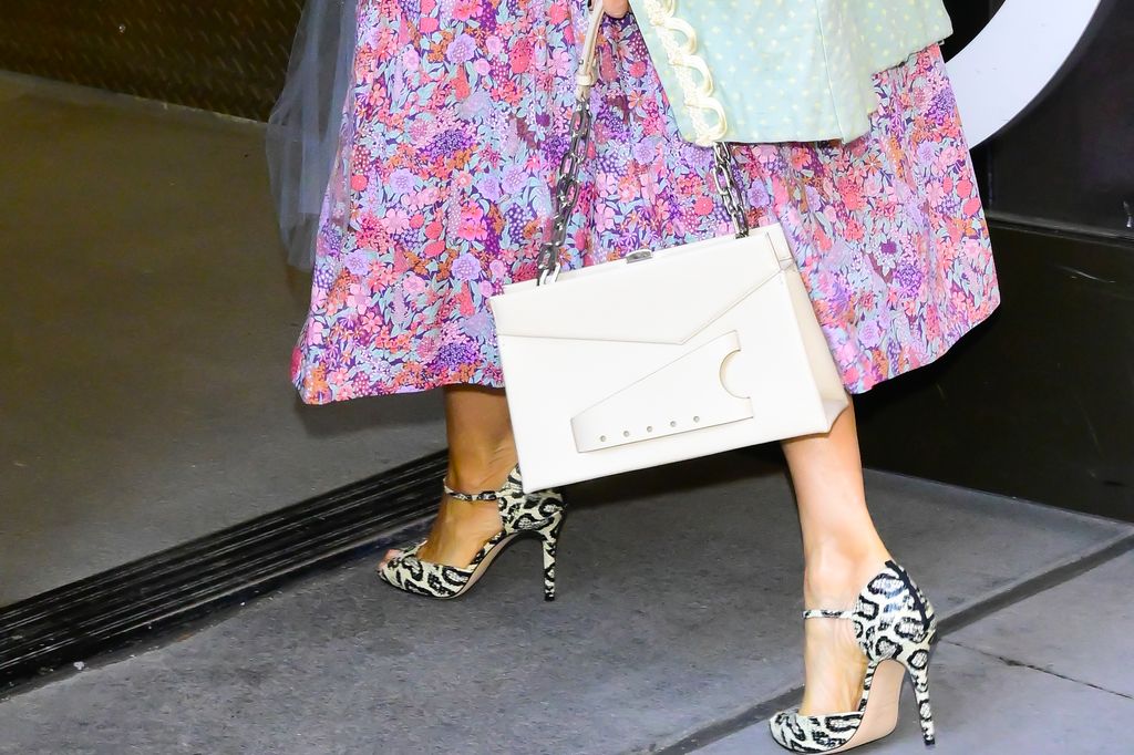 close up of sarah jessica parker's feet in leopard print heels