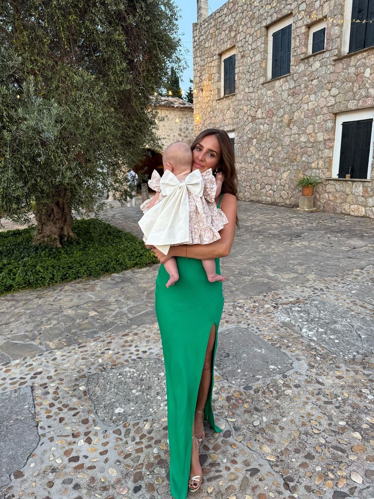 Palma looked so pretty in her chic dress in the arms of her auntie, Katie