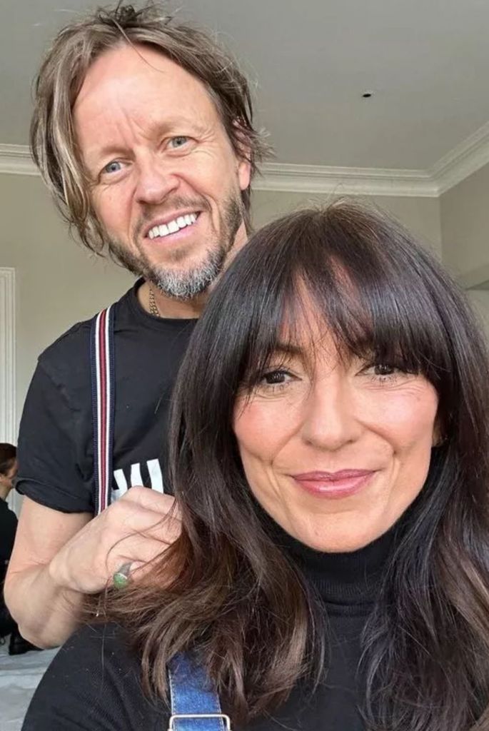 Selfie of Davina McCall with Michael Douglas standing behind smiling 