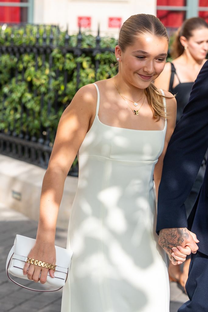 Harper Beckham wearing white dress during Paris fashion week