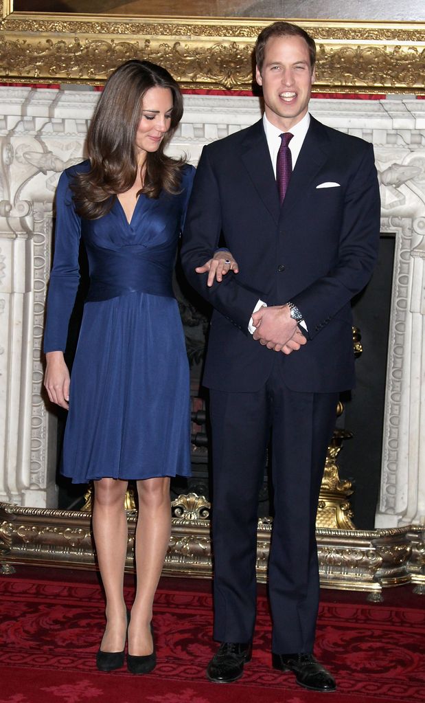 Kate pictured admiring her engagement ring during her and Prince William's engagement announcement