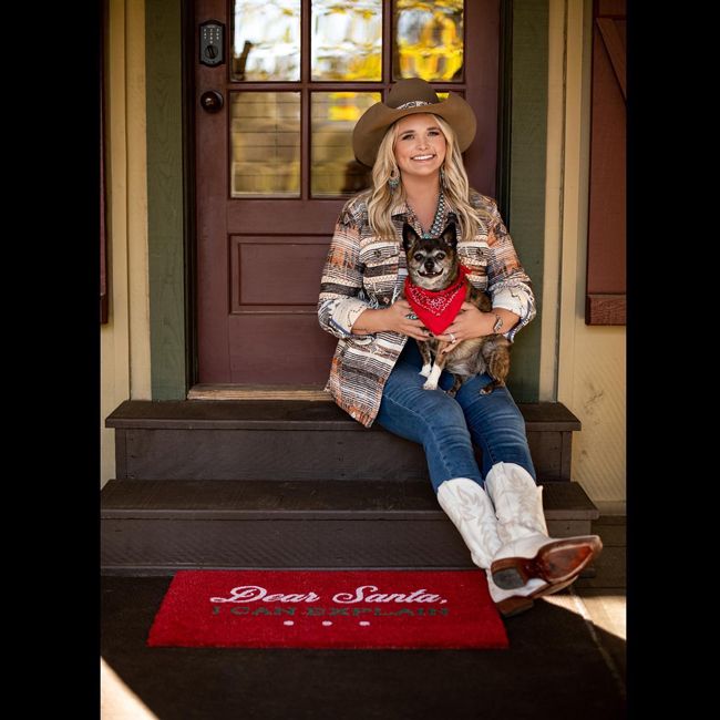 Miranda Lambert with her dog on her front porch