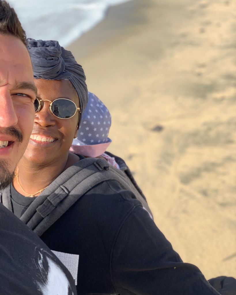 Motsi Mabuse on beach with baby and husband