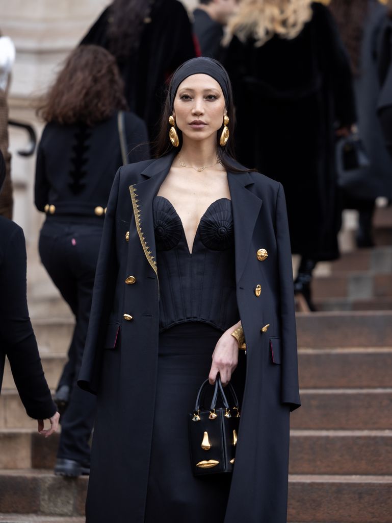 Soo Joo Park attends the Schiaparelli Haute Couture Spring/Summer 2024 in an all black outfit. 
