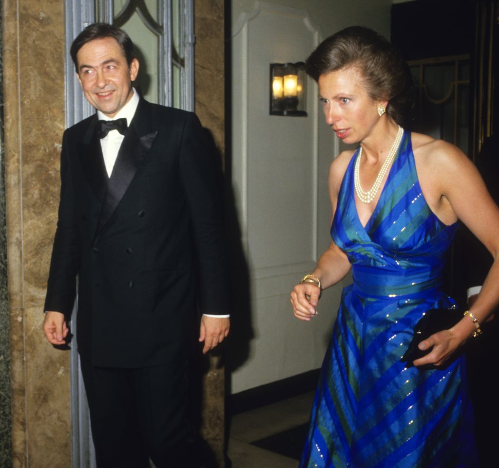 Princess Anne beside King Constantine of Greece in 80s party dress
