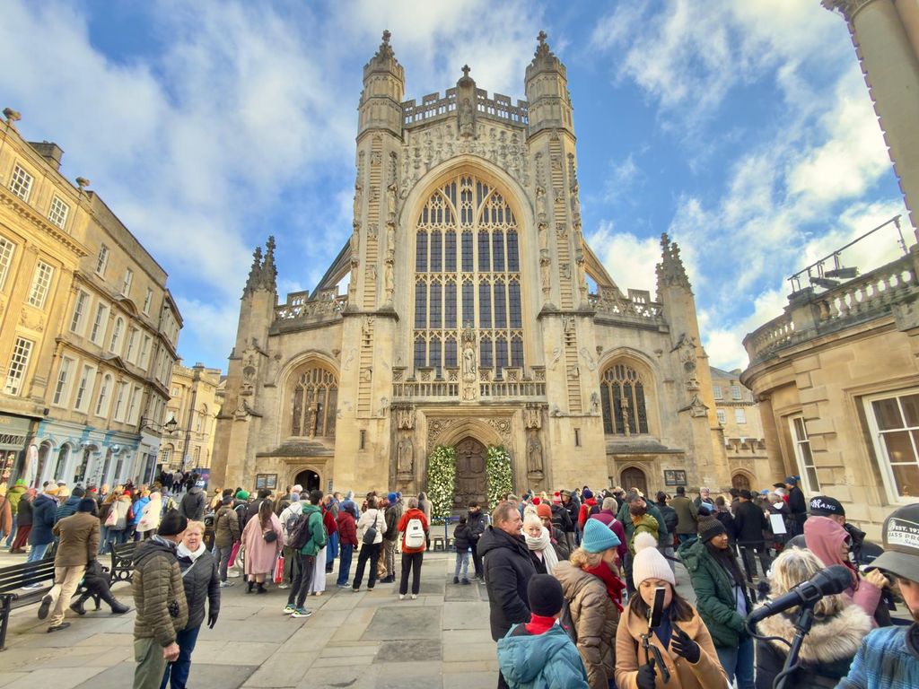 A photo of Bath Abbey against a blue sky