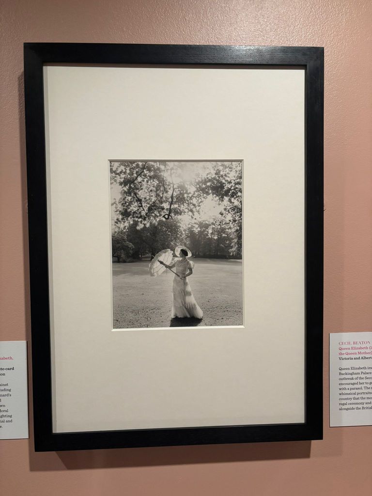 Frame of Queen Mother in white dress and parasol taken by Cecil Beaton in 1939