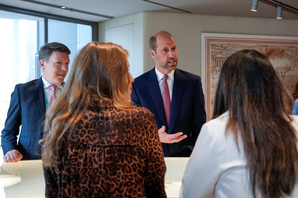 prince william talking to group of people 
