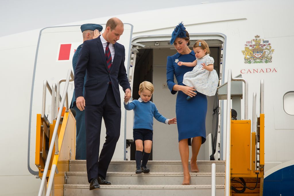 Prince William and Princess Kate departing a plane with Prince George and Princess Charlotte