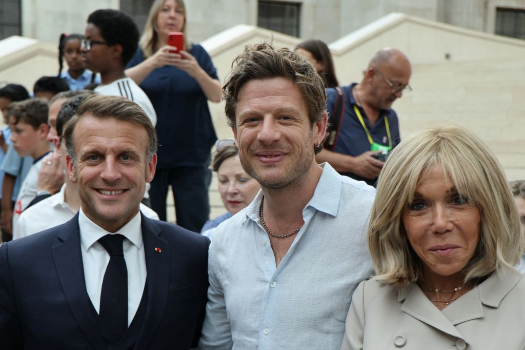 James Norton posing with Emmanuel and Brigitte Macron