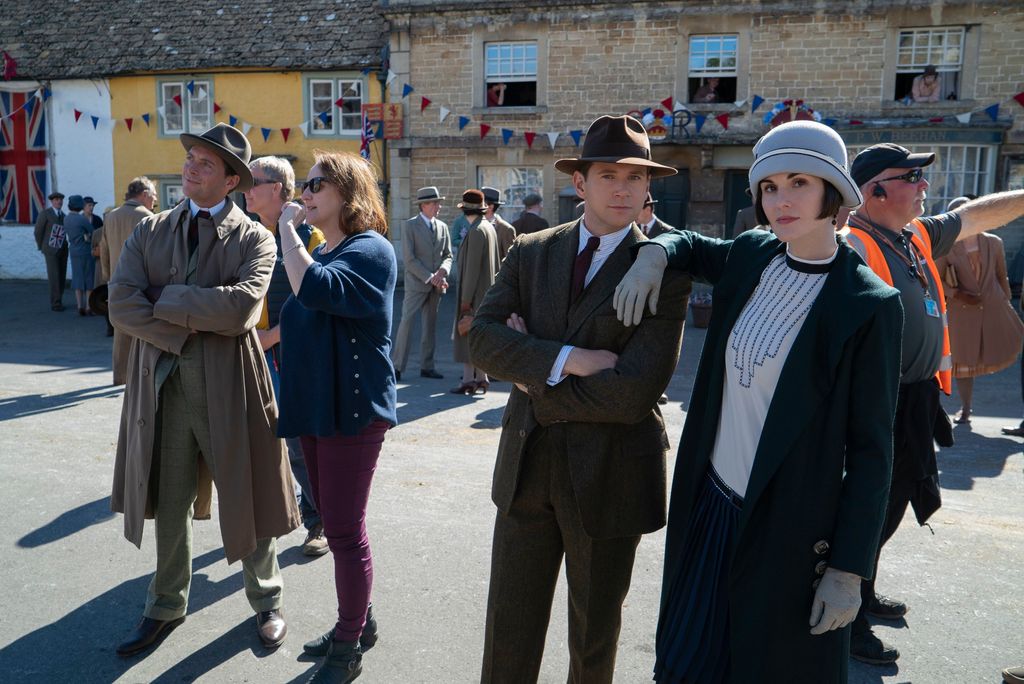 Cast of Downton Abbey stand in square during first movie
