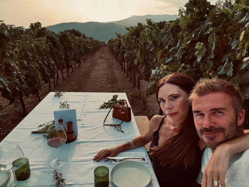 Victoria Beckham and David Beckham dining at a vineyard