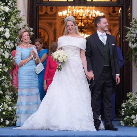 Celia also designed Queen Anne-Marie's blue tiered dress (left)