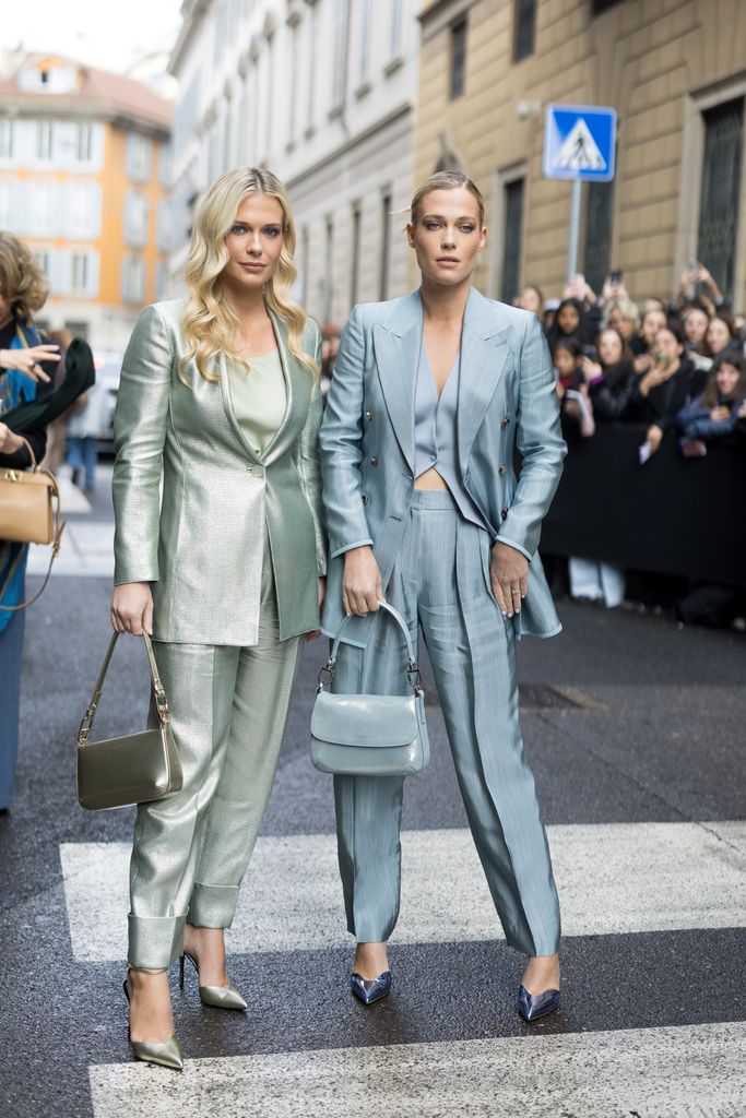 twins in metallic suits