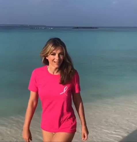 Elizabeth Hurley in pink shirt and bikini bottoms