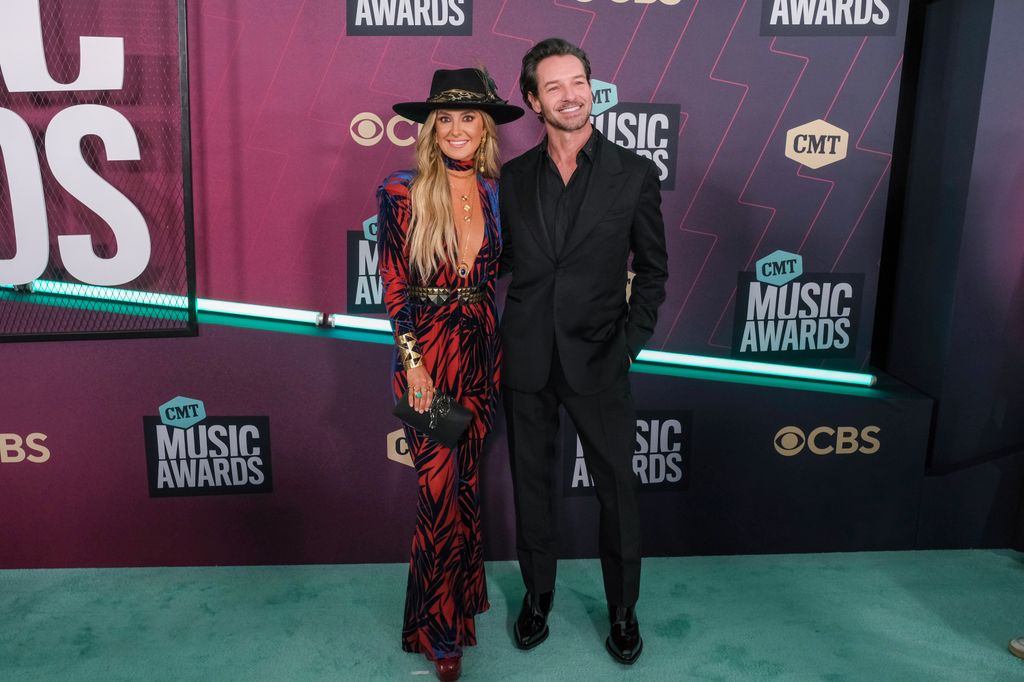 Lainey Wilson and Ian Bohen attend the 2023 CMT Music Awards at Moody Center