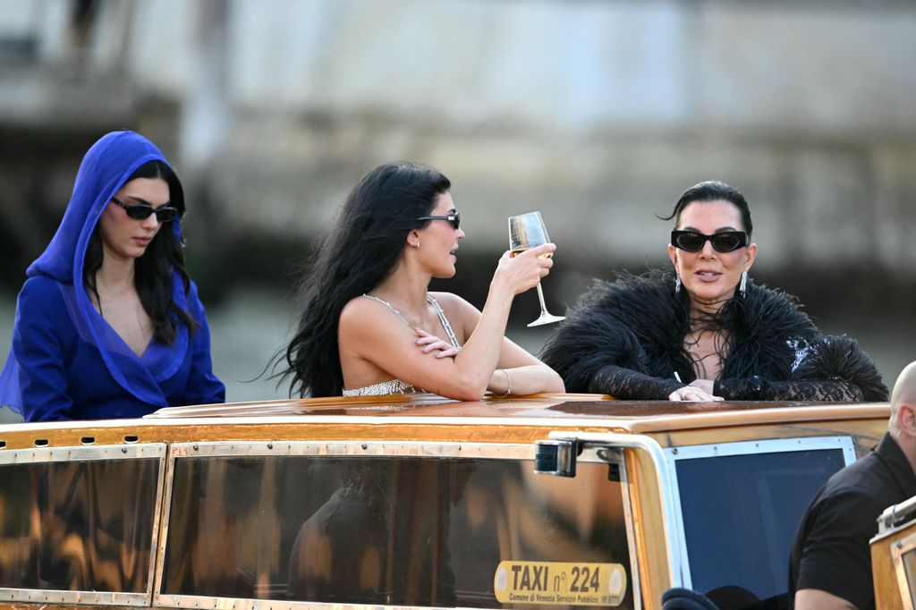 US model Kendall Jenner (L), US television personality Kris Jenner (R) and US Kylie Jenner leave the Gritti Palace Hotel for a party on the third day of the wedding of US Amazon founder Jeff Bezos with Lauren Sanchez, in Venice on June 28, 2025.      