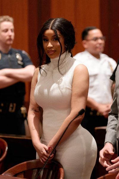 Cardi B's courtroom white coat and skin-tight turtleneck outfit is