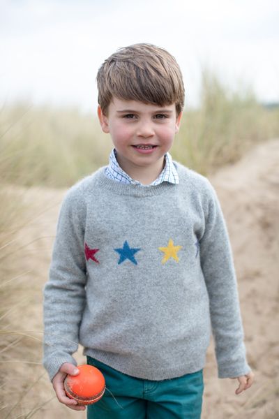 prince louis holding ball birthday beach