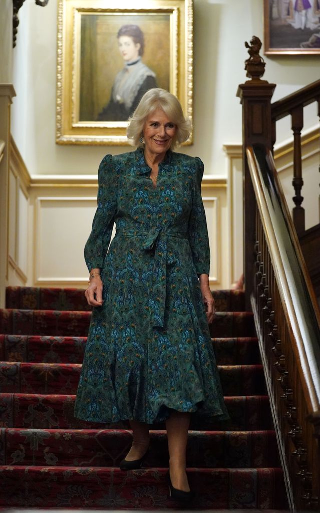 Queen Camilla stunned in a peacock-print dress