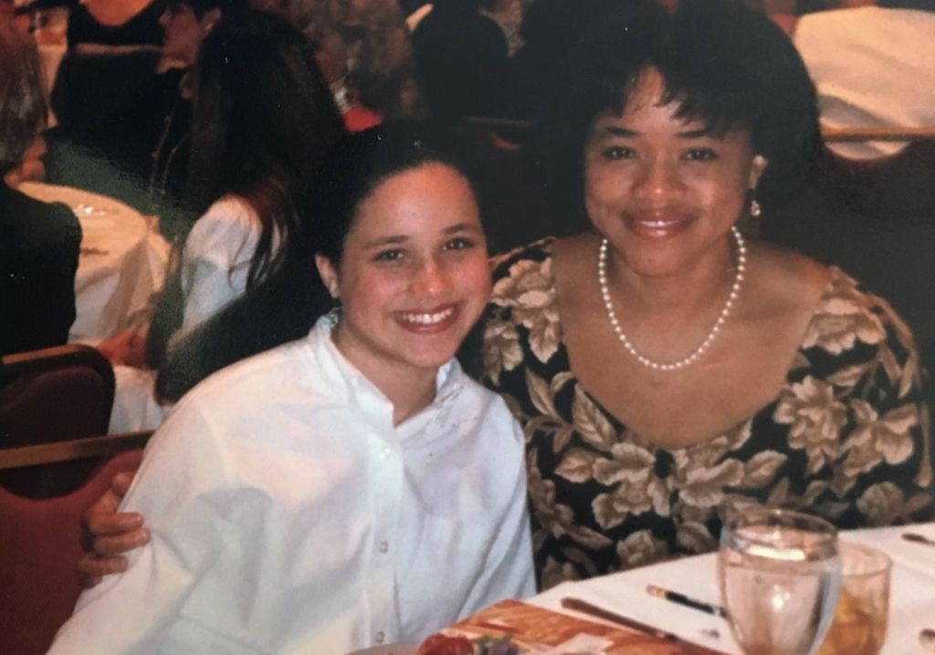 A young Meghan Markle and Doria Ragland at a dinner